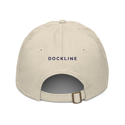 Pointe au Baril Cap in Oyster with navy DOCKLINE embroidery, back view