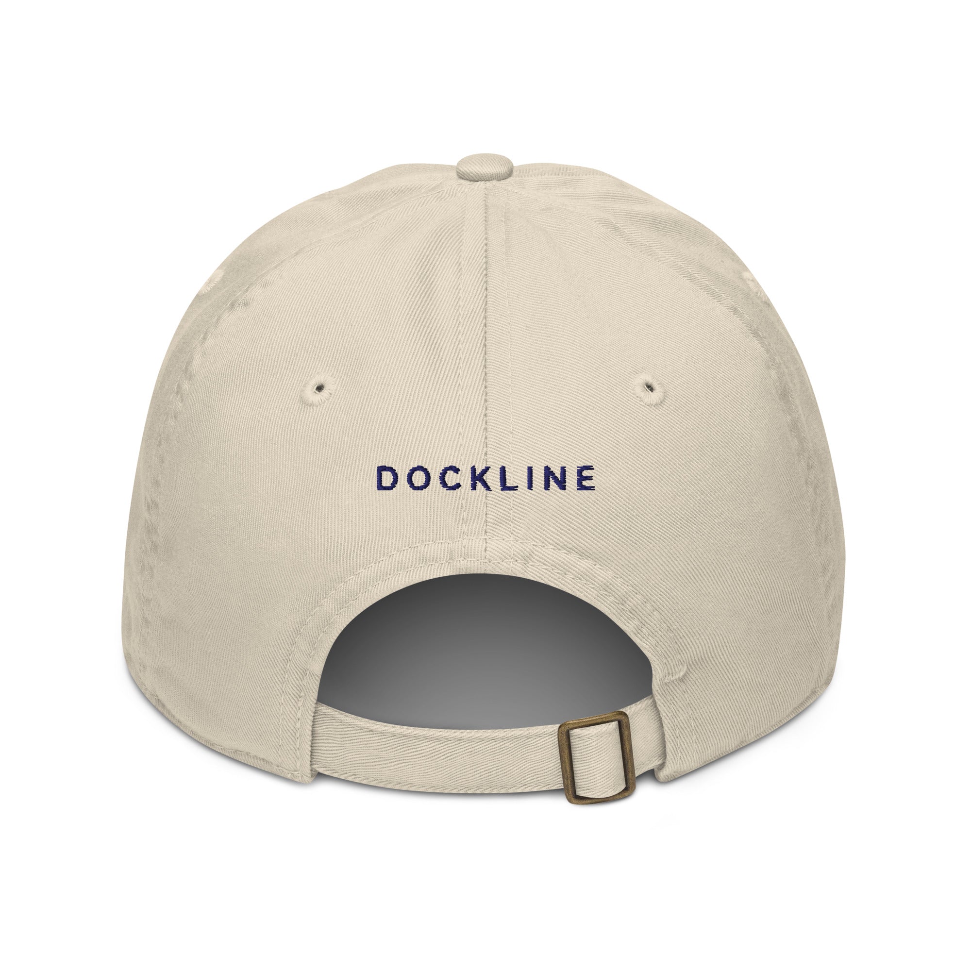 The Snug Cap in Oyster with navy embroidery, back view